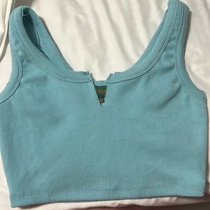 turquoise blue crop top with a slit in the front